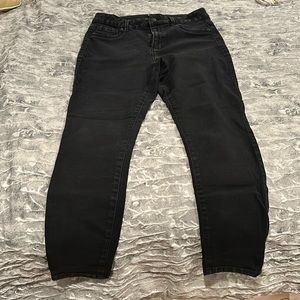 Distressed black jeans. 16